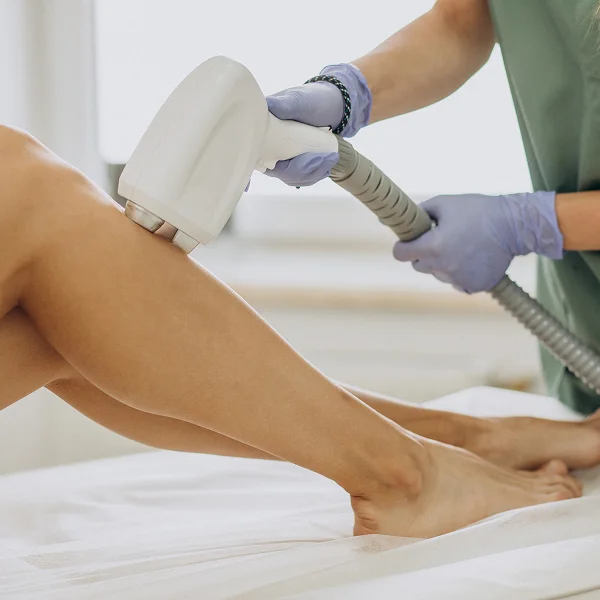 A woman undergoing a hair removal treatment at a spa in Saint-Hyacinthe, focused on her skincare routine.